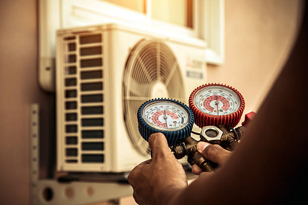 Professional Hvac technician working in Harned, KY